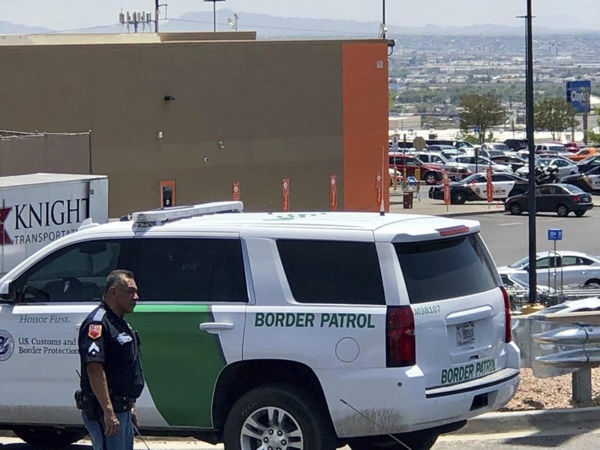 Law enforcement work the scene of a shooting at a shopping mall in El Paso, Texas, on Saturday, Aug. 3, 2019. Multiple people were killed and one person was in custody after a shooter went on a rampage at a shopping mall, police in the Texas border town of El Paso said.