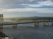 The I-5 Bridge stretches over the Columbia River during a sunrise in September.