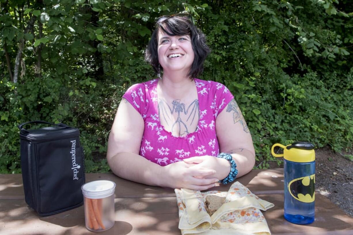 Heather Fisher of Vancouver strives to reduce garbage. She packed her lunch in reusable containers for a picnic at Hockinson Meadows Community Park, but wishes she could take her own containers to fill at the grocery store, a practice currently prohibited by Washington health codes. Proposed revisions would change that.