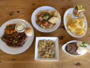 Brisket Platter, clockwise from left, spaghetti and meatballs, ceviche, apple crisp a la mode and Truffle Mac at Alex Smokehouse.