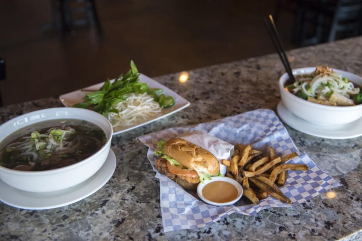 The Pho Tai Nam (eye round and flank noodle soup), from left, the Krispy Chicken Burger and the Vegetarian Noodle Soup at the Kooky Chicken.