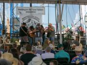 Tom Weisgerber takes the stage Sunday afternoon during Championship Round 3 of the Washington State Fiddle Championships at the Clark County Fair. Weisgerber took the top prize and the $1,000 reward that comes with it.