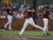 Ridgefield Raptors’ Cameron Repetti (6) scores on a passed ball against the Bend Elks at the Ridgefield Outdoor Recreation Complex on Friday evening. Repetti was the hero on Saturday with a three-run game-winning home run in the 11th inning.