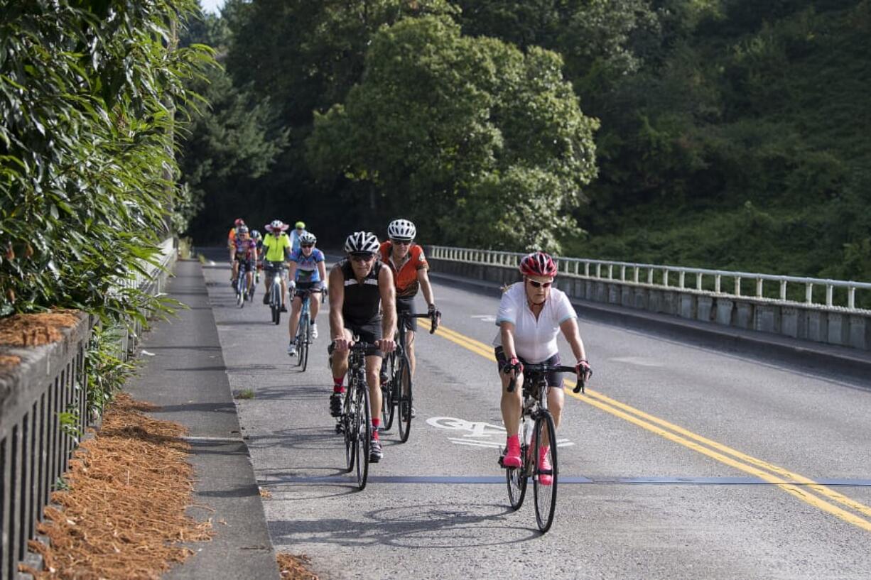 Alisha Jucevic/The Columbian There are no bike lanes where Fruit Valley Road crosses railway tracks and Burnt Bridge Creek, so cyclists are directed to use the whole travel lane. But that takes courage amidst car and truck traffic traveling at 35 mph or more.