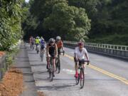 Alisha Jucevic/The Columbian There are no bike lanes where Fruit Valley Road crosses railway tracks and Burnt Bridge Creek, so cyclists are directed to use the whole travel lane. But that takes courage amidst car and truck traffic traveling at 35 mph or more.