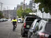 Vancouver Parking Enforcement Officer Tim Brown patrols the streets surrounding the Clark County Courthouse last week. The area around the courthouse gets busy and the officers’ goal, he said, is to create turnover. “We’re not trying to punish people,” he said.