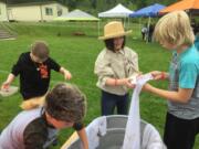 RIDGEFIELD: On Pioneer Day, fourth-grade students at South Ridge Elementary School learned to wash clothes the old-fashioned way: with bars of soap, washboards and tubs of water. Following several weeks of learning about pioneers, students had the opportunity to dress up and simulate the real activities of pioneers.