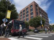 Attendees of the Vancouver City Council mobile workshop load onto a C-Tran bus at the beginning of the tour on Monday evening, Aug. 12, 2019.