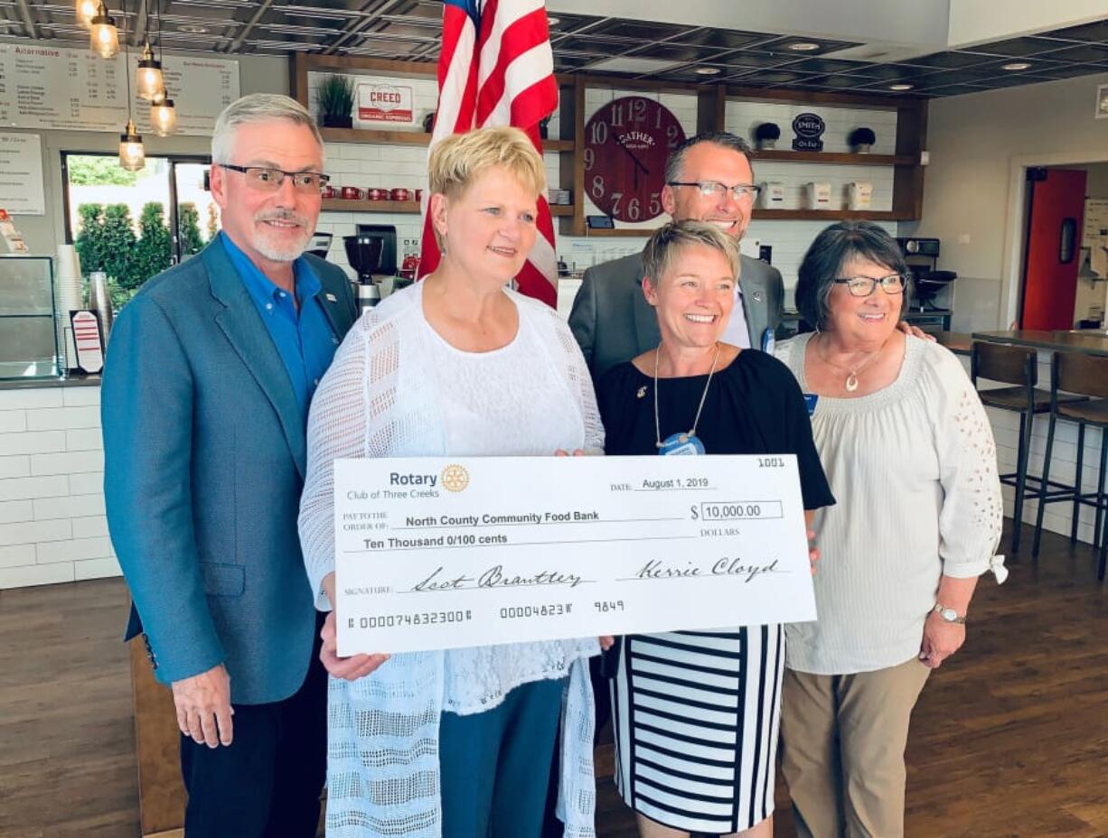 Battle Ground: The Rotary Club of Three Creeks donated $10,000 to the North County Food Bank. From left: Rotary Zone 27 Rep. Steve Lingenbrink, Liz Cerveny, executive director of the food bank, past presidents Susanne and Nelson Holmberg and District 5100 Gov. Diane Noriega.