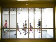 Parents and students tour the new Peter S. Ogden Elementary School during a back-to-school night on Monday night. The distinctive floor-to-ceiling glass windows bathe rooms in natural light, an effort to bring the outdoors in at the new school.