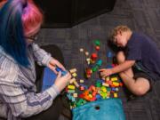 Dominic Cowell and his behavioral therapist, Ali Hill-Alton, play with building blocks during their session at CARD. CARD was started in 1990 by Doreen Granpeesheh, a clinical psychologist and behavior analyst.