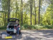 Sarah Croston, assistant guide and educator at the Mount St. Helens Institute takes stock of her equipment while preparing to lead a hike to the Mount. St. Helens crater.