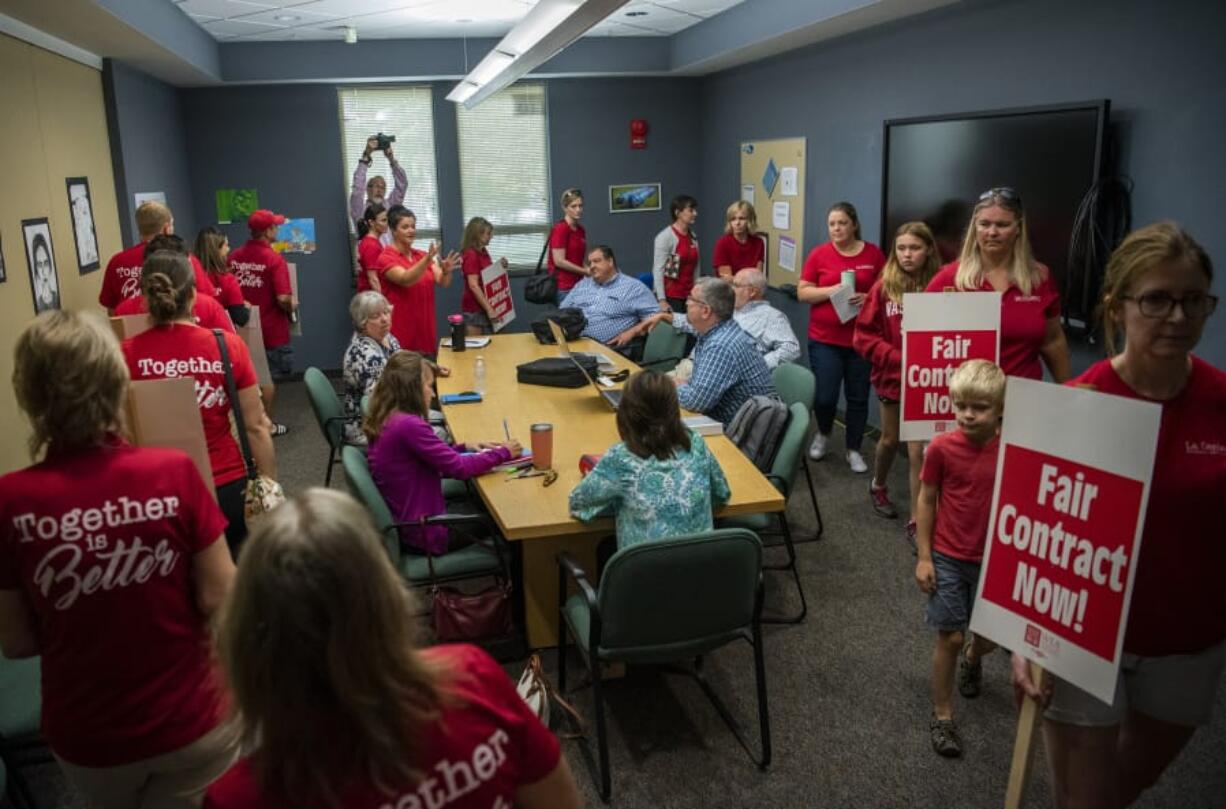 After the district refused to walk down a hallway lined with teachers to meet with the union’s bargaining committee in a conference room, the teachers walked down the hall and filed through the room where the district was waiting at La Center High School this morning. After the teachers filed through the room, the bargaining team entered and began the bargaining session with the district. The union voted 75-1 on Thursday to go on strike if a new deal isn’t reached by the first day of school on Aug. 28.