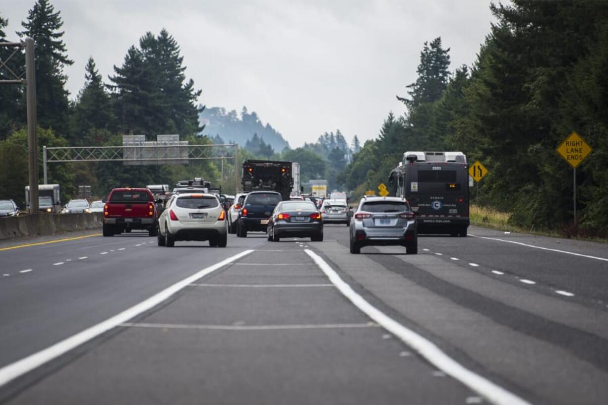 Vehicles merge onto state Highway 14 eastbound Wednesday afternoon from Interstate 205. Washington State Department of Transportation officials are urging drivers, during heavy congestion, to wait until their lane ends before doing a “zipper” merge with other vehicles.