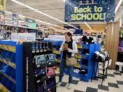 Ana Martinez of Vancouver picks out pencils in the back-to-school section at Fred Meyer in Hazel Dell.