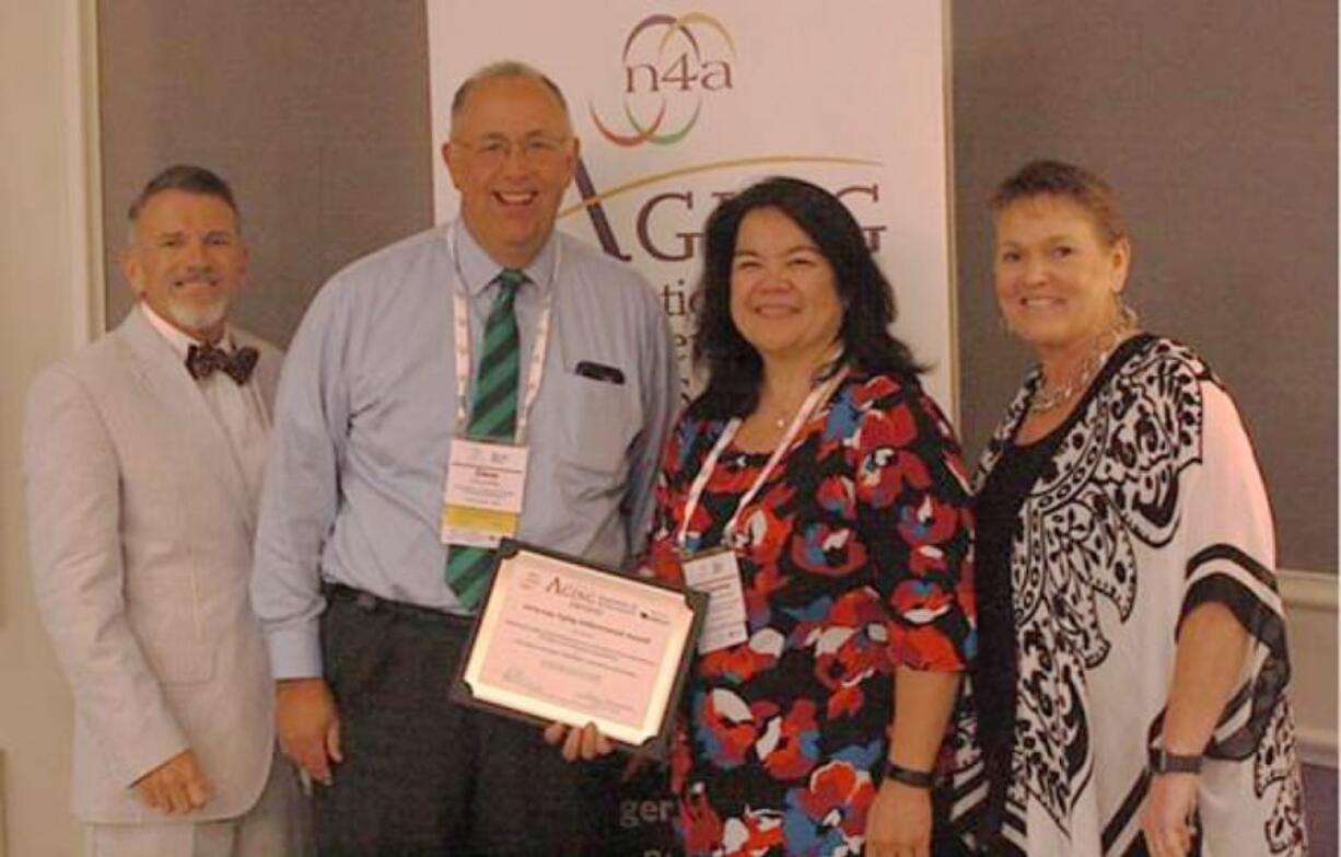 WEST HAZEL DELL: From left, Mark Henry, director, LTC and HCBS Contracting WellCare Health Plans Inc.; Dave Kelly, executive director, Area Agency on Aging & Disabilities of Southwest Washington; Christina Marneris, community services program supervisor, Area Agency on Aging & Disabilities of Southwest Washington; and Deborah Stone-Walls, president, National Association of Area Agencies on Aging. The agency, which serves Clark, Cowlitz, Klickitat, Skamania and Wahkiakum counties, was awarded an Aging Achievement Award at the annual conference of the National Association of Area Agencies on Aging held in New Orleans.