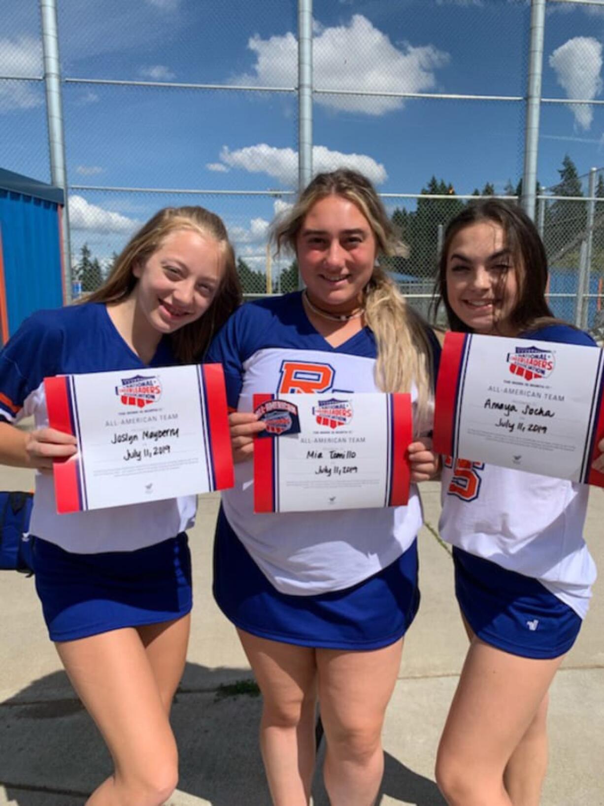 Joslyn Mayberry, Mia Tomillo and Amaya Socha of the Ridgefield High School Cheer Team