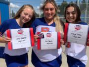 Joslyn Mayberry, Mia Tomillo and Amaya Socha of the Ridgefield High School Cheer Team