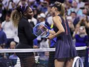 Serena Williams, left, shakes hands with Maria Sharapova after their first-round match at the U.S. Open tennis tournament in New York, Monday, Aug. 26, 2019. Williams won.