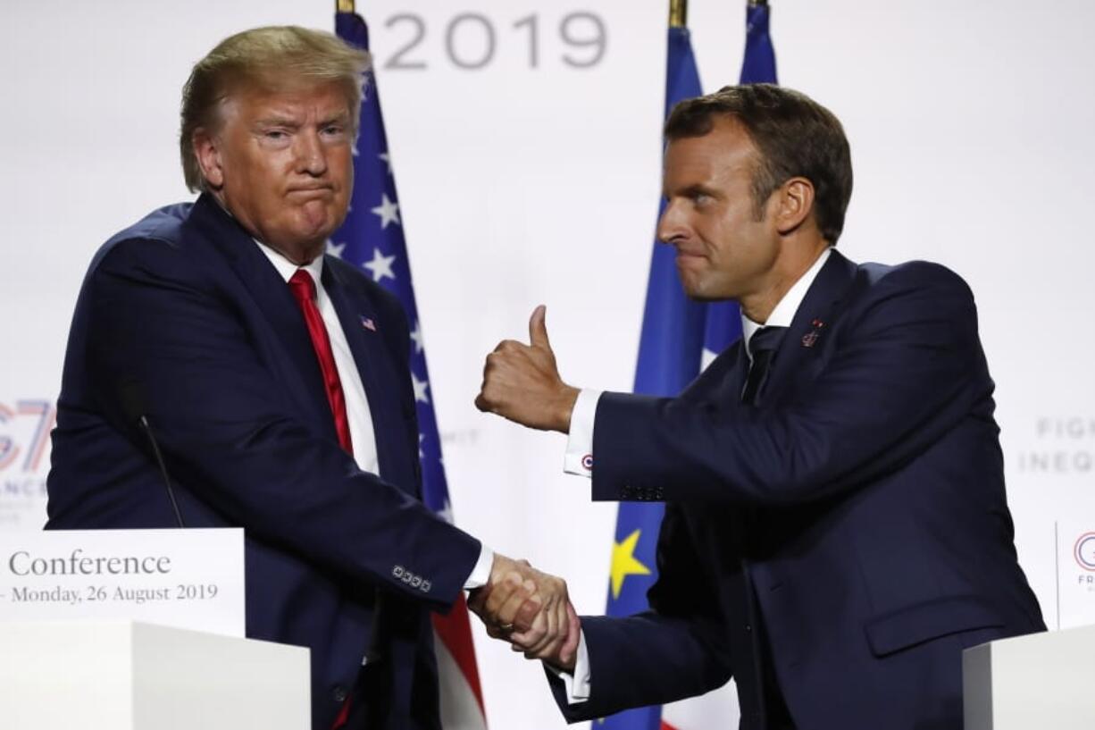 French President Emmanuel Macron and U.S President Donald Trump shake hands during the final press conference during the G7 summit Monday, Aug. 26, 2019 in Biarritz, southwestern France. French president says he hopes for meeting between US President Trump and Iranian President Rouhani in coming weeks.