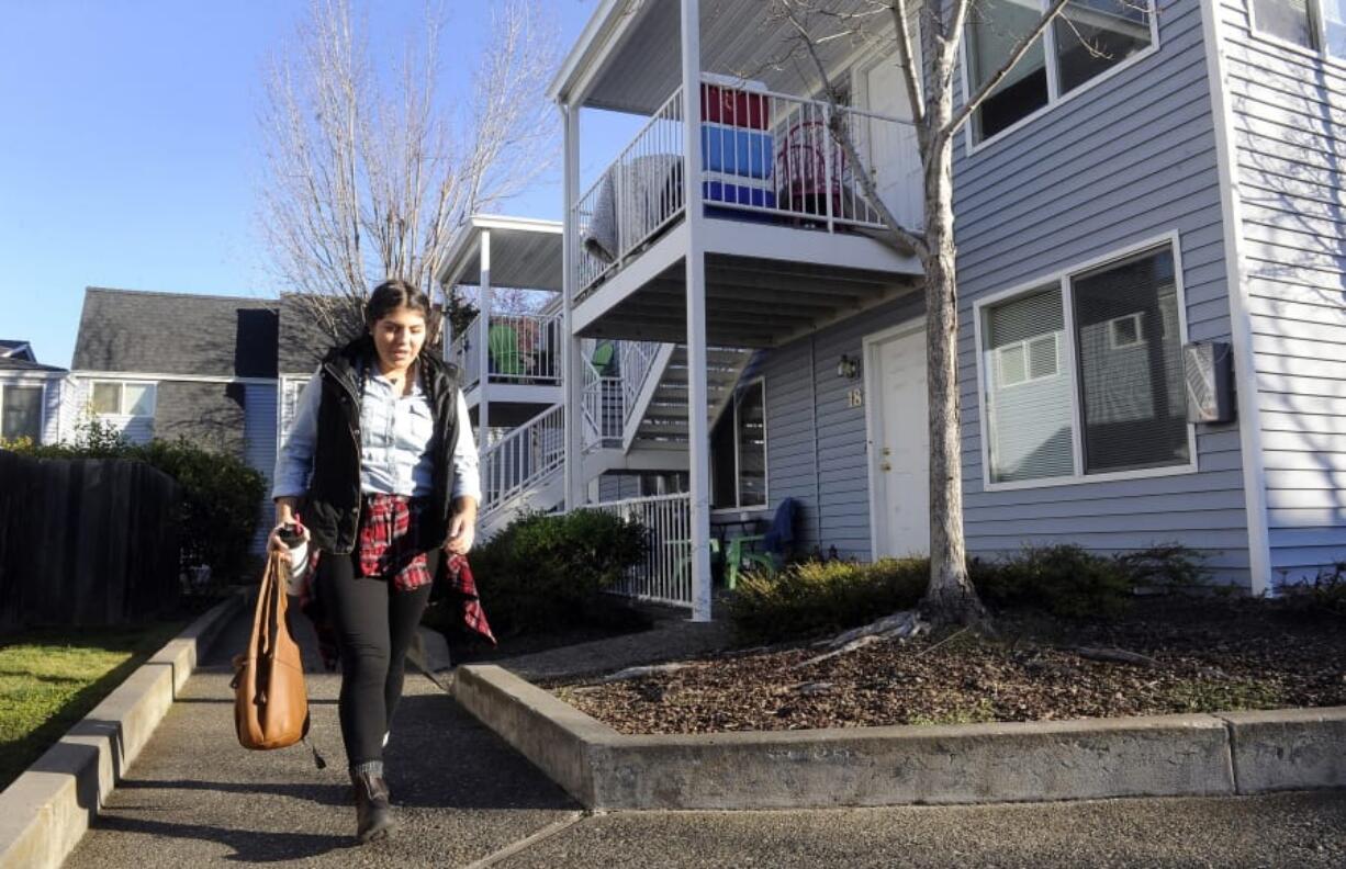 Monica Magdaleno leaves her apartment Dec. 7, 2017, on Garfield Street in Ashland, Ore. Gov. Kate Brown signed a first-in-the-nation law Thursday to encourage the development of duplexes, triplexes and other more affordable types of housing.