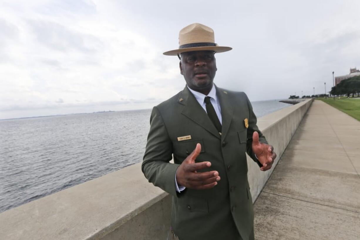 Terry E. Brown, Superintendent of the Fort Monroe National Monument gestures near the spot of the first landing of Africans in America 400 years ago at Fort Monroe in Hampton, Va., Thursday, Aug. 15, 2019.