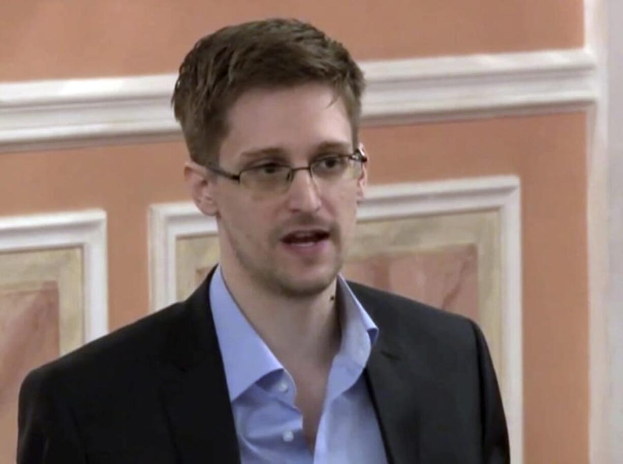 FILE - In this Oct. 11, 2013 file image made from video and released by WikiLeaks, former National Security Agency systems analyst Edward Snowden speaks in Moscow. Snowden has written a memoir. Metropolitan Books announced Thursday, Aug. 1, 2019, that Snowden’s “Permanent Record” will be released simultaneously in more than 20 countries, including the U.S. and Britain on Sept.