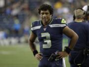 Seattle Seahawks quarterback Russell Wilson on the sideline against the Denver Broncos during the second half of an NFL football preseason game, Thursday, Aug. 8, 2019, in Seattle.