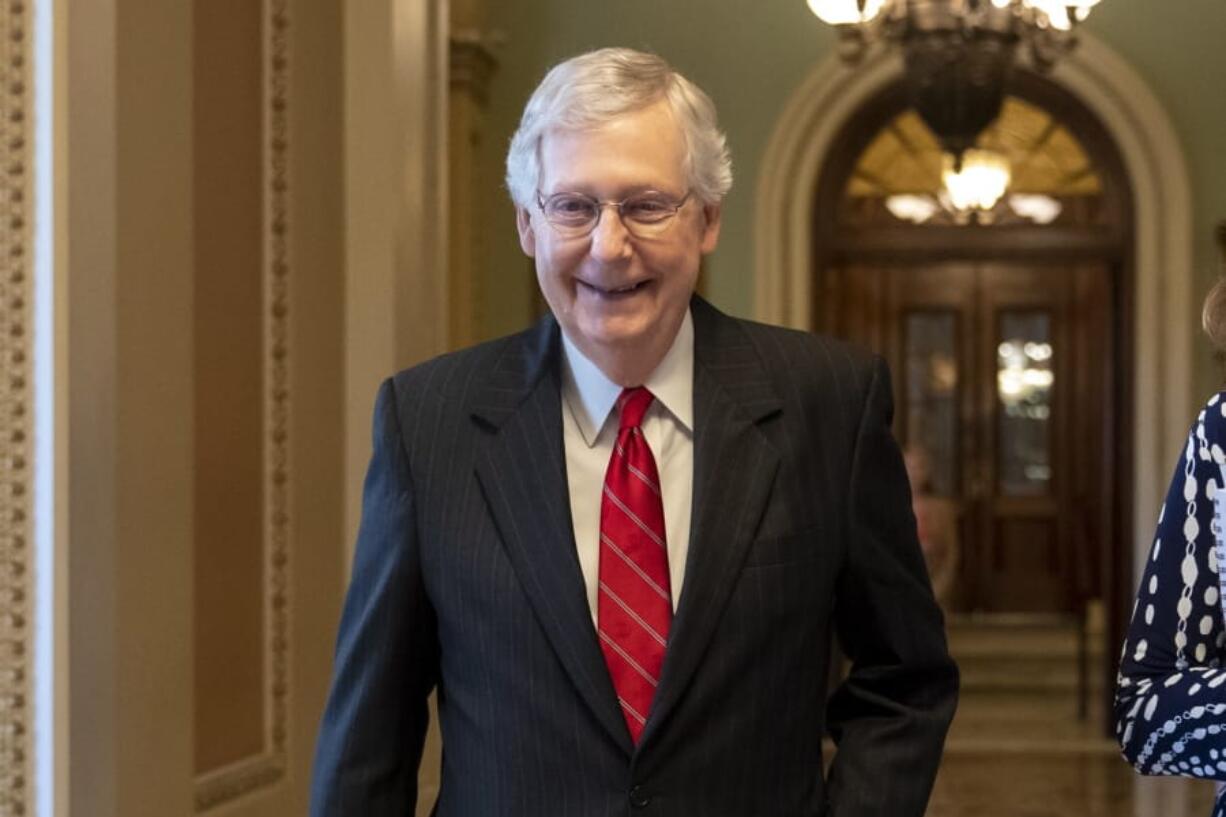 Senate Majority Leader Mitch McConnell, R-Ky., smiles after vote on a hard-won budget deal that would permit the government to resume borrowing to pay all of its obligations and would remove the prospect of a government shutdown in October, at the Capitol in Washington, Thursday, Aug. 1, 2019. (AP Photo/J.