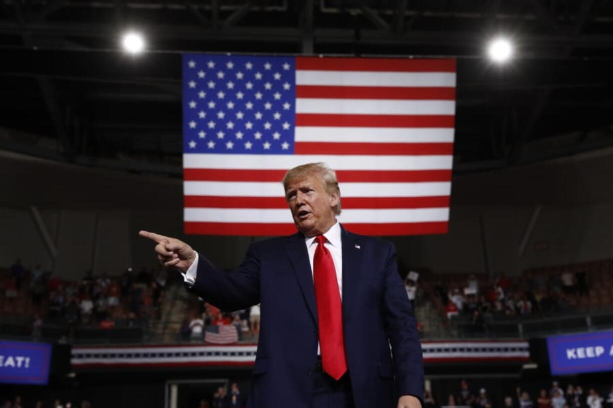 President Donald Trump reacts Thursday at the end of his speech at a campaign rally in Manchester, N.H. The Trump administration is aggressively pursuing economic sanctions as a primary foreign policy tool to an extent unseen in decades, or perhaps ever. Many are questioning the results even as officials insist the penalties are achieving their aims.