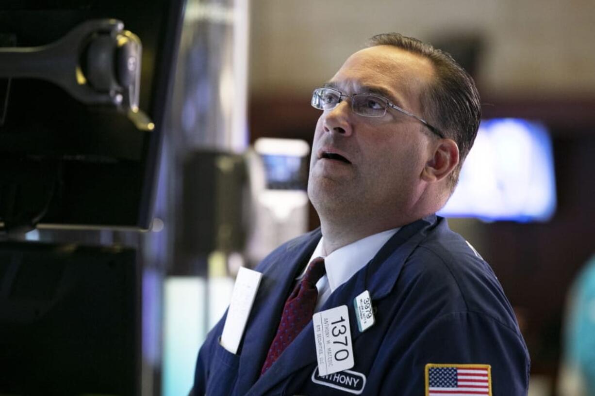 Specialist Anthony Matsic works at his post on the floor of the New York Stock Exchange, Monday, Aug. 12, 2019. Stocks are edging lower in early trading on Wall Street amid investor concerns that the U.S.-China trade war may be worsening.