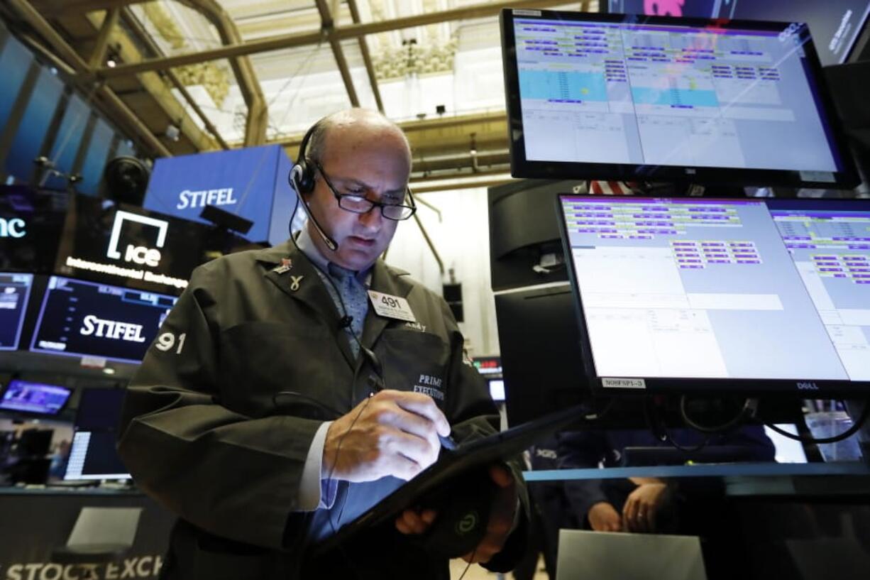 Trader Andrew Silverman works on the floor of the New York Stock Exchange, Tuesday, Aug. 6, 2019. Stock markets turned higher on Tuesday as China stabilized its currency after allowing it to depreciate against the dollar in response to President Donald Trump’s decision to put more tariffs on Chinese goods.