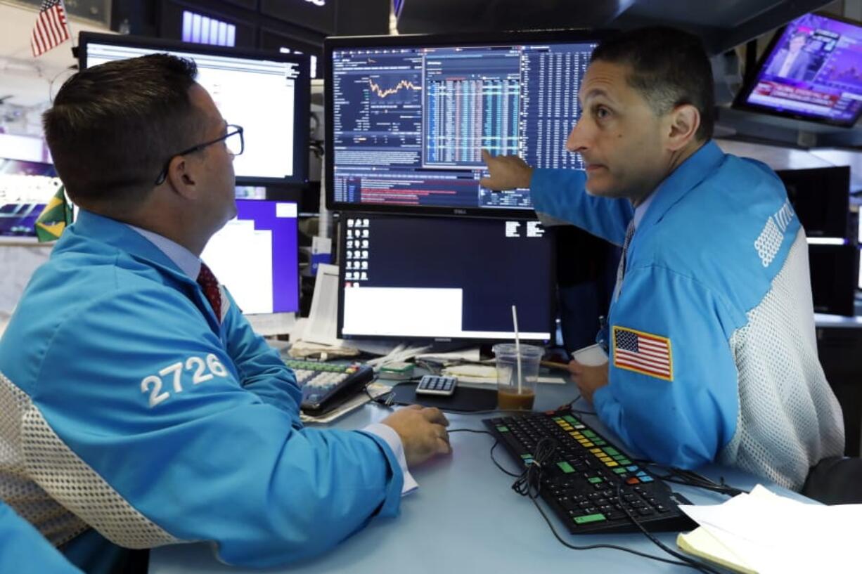 f Specialists Paul Cosentino, left, and Jeffrey Berger work on the floor of the New York Stock Exchange, Monday, Aug. 5, 2019. U.S. stocks nosedived in early trading on Wall Street Monday as China’s currency fell sharply and stoked fears that the trade war between the world’s two largest economies would continue escalating.