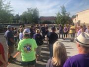 Adam Aguilera, an Evergreen Public Schools teacher and applicant for an open Vancouver school board seat, addresses a crowd of bus drivers, maintenance crew and others following a school board meeting on Tuesday, Aug. 13, 2019. The staff, who are represented by the Service Employees’ International Union, Local 925, settled with the district on a three-year contract after months of bargaining.