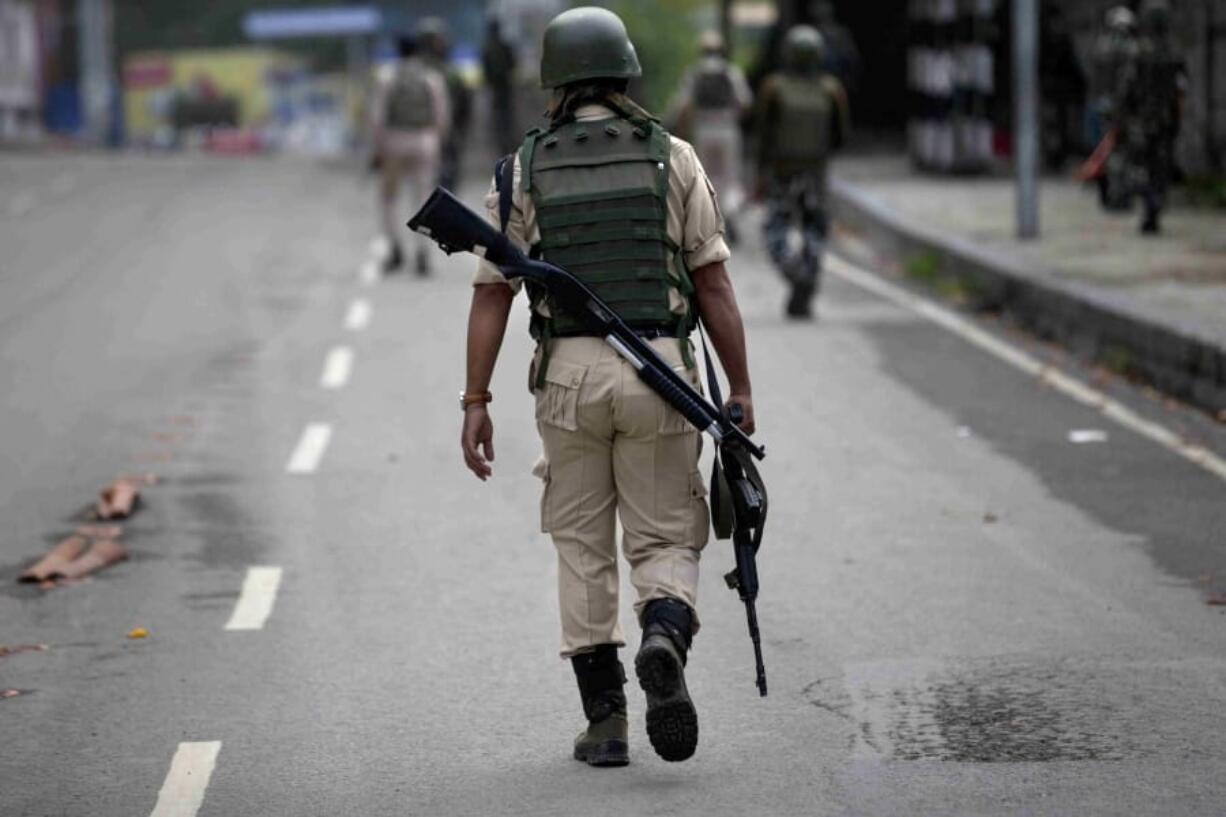 Indian paramilitary soldiers patrol on the road leading towards Independence Day parade venue during lockdown in Srinagar, Indian controlled Kashmir, Thursday, Aug. 15, 2019. Indian Prime Minister Narendra Modi says that stripping the disputed Kashmir region of its statehood and special constitutional provisions has helped unify the country. Modi gave the annual Independence Day address from the historic Red Fort in New Delhi as an unprecedented security lockdown kept people in Indian-administered Kashmir indoors for an eleventh day.