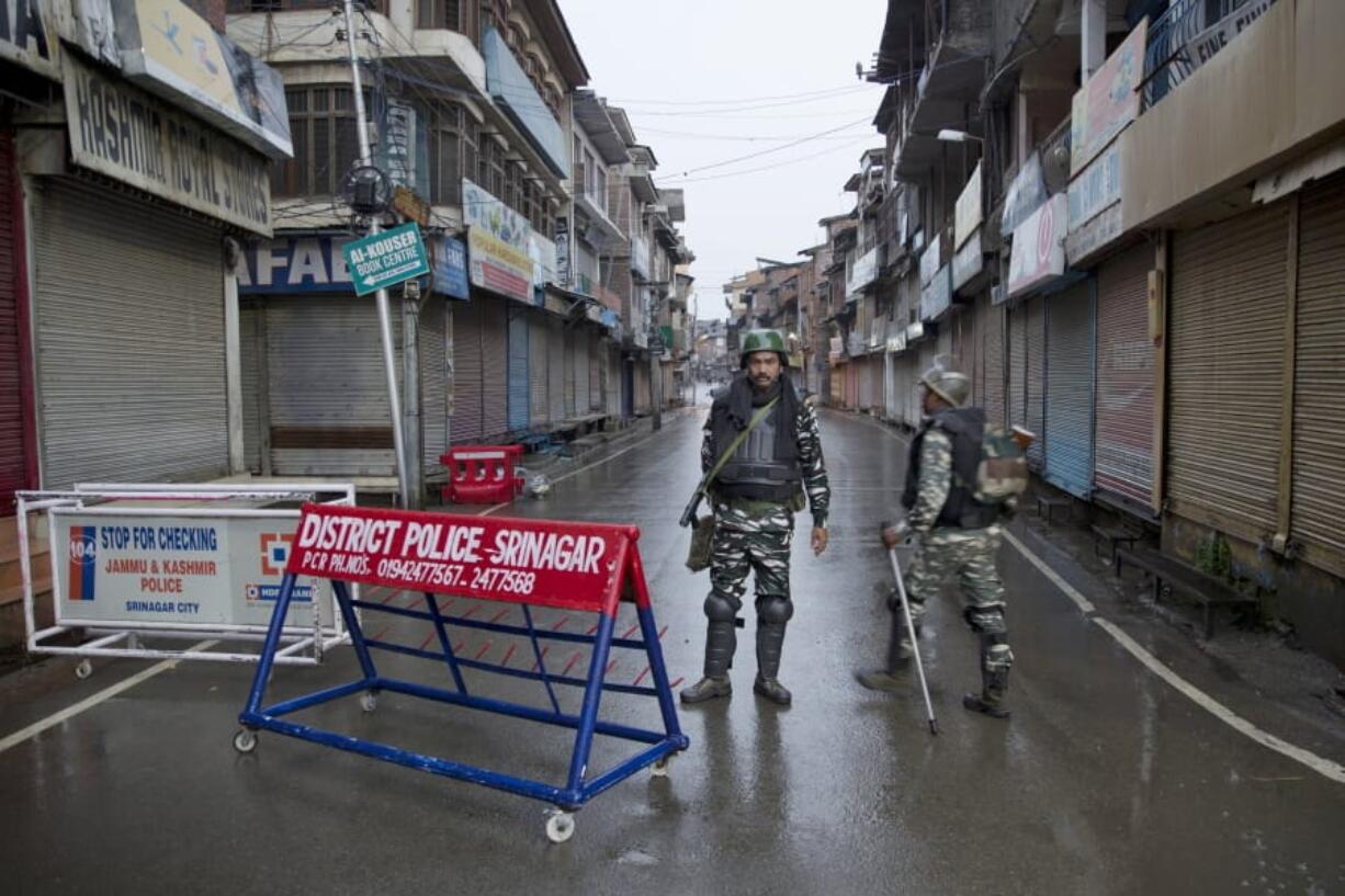 Indian paramilitary soldiers stand guard during security lockdown in Srinagar, Indian controlled Kashmir, Wednesday, Aug. 14, 2019. India has maintained an unprecedented security lockdown to try to stave off a violent reaction to Kashmir’s downgraded status. Protests and clashes have occurred daily, thought the curfew and communications blackout have meant the reaction is largely subdued.