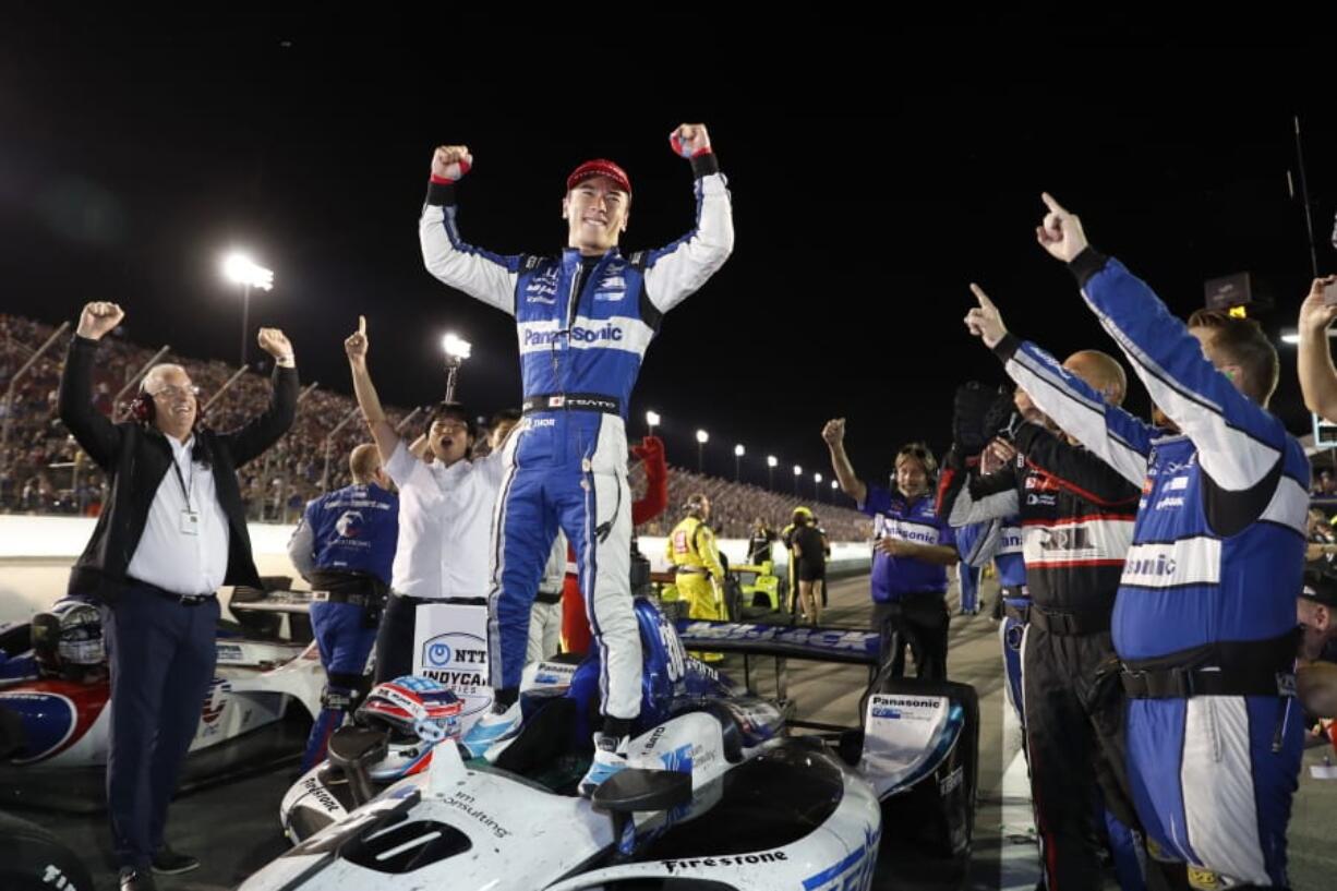 Takuma Sato celebrates after winning the IndyCar auto race at World Wide Technology Raceway on Saturday, Aug. 24, 2019, in Madison, Ill.