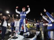 Takuma Sato celebrates after winning the IndyCar auto race at World Wide Technology Raceway on Saturday, Aug. 24, 2019, in Madison, Ill.