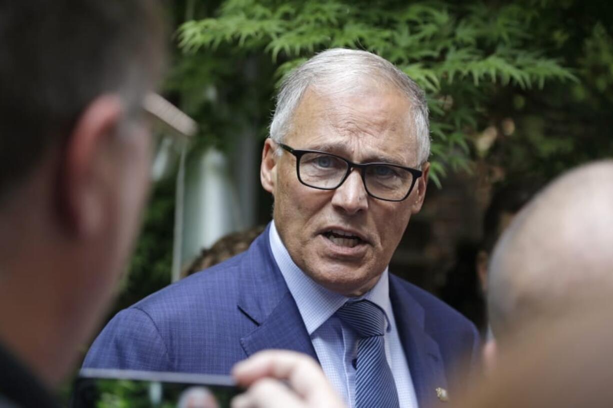 Gov. Jay Inslee speaks with reporters about his plans to run for a third term as governor Thursday, Aug. 22, 2019, in Seattle. Inslee, who has ended his climate change-focused 2020 presidential bid, announced his plans earlier Thursday via email, hours before appearing at a news conference at Planned Parenthood in Seattle regarding the Title X family planning program.