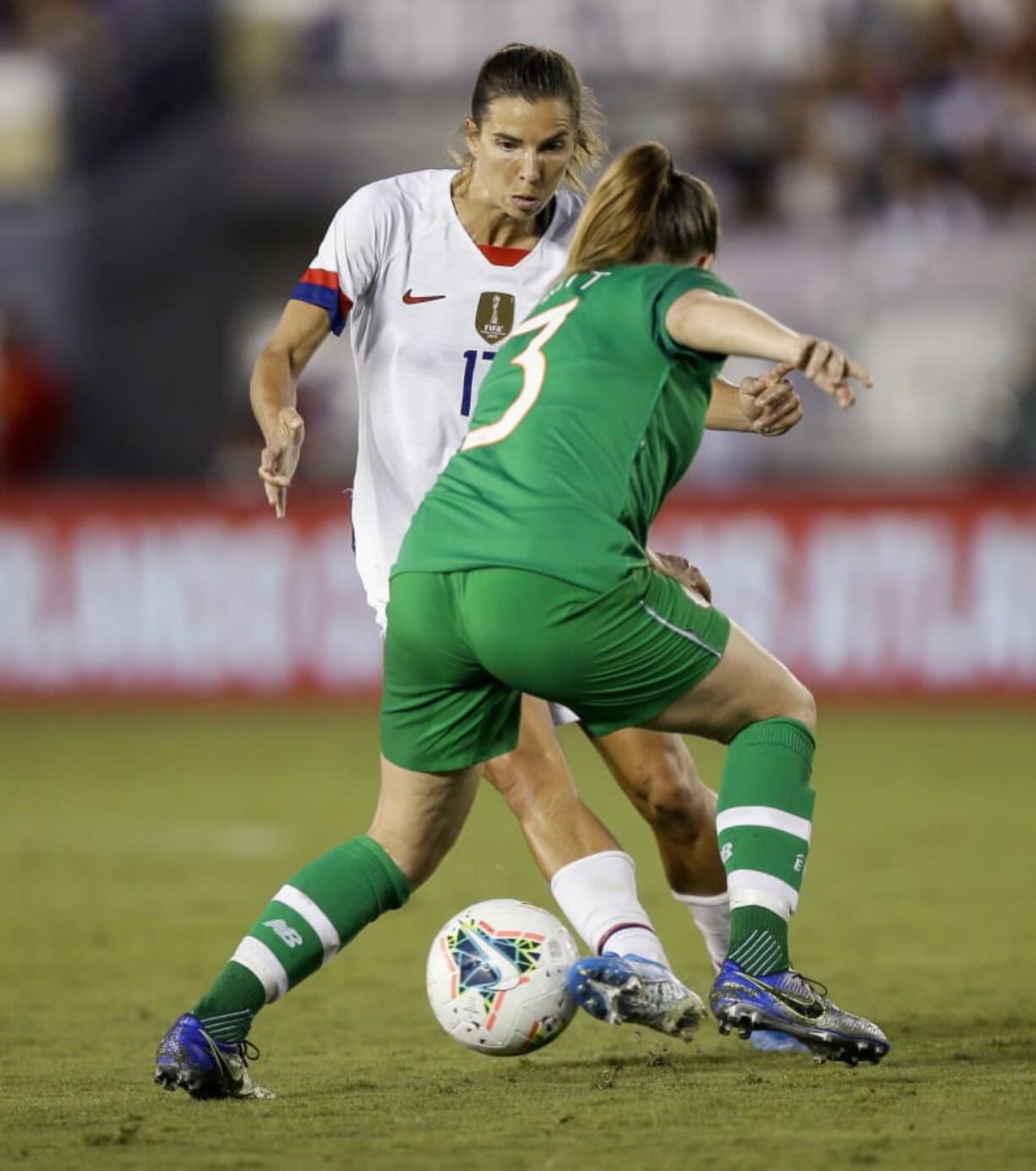 U.S. forward Tobin Heath, left, a member of the Portland Thorns, works the ball around Ireland defender Harriet Scott during the first half of an international friendly on Saturday at Pasadena, Calif.