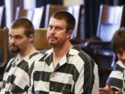 Ryan Leaf, center, sits in a Cascade County courtroom in Great Falls, Mont., in 2012. Ryan Leaf spent most of his time in prison alone and angry until a military veteran persuaded him to stop self-loathing long enough to help fellow inmates learn to read.