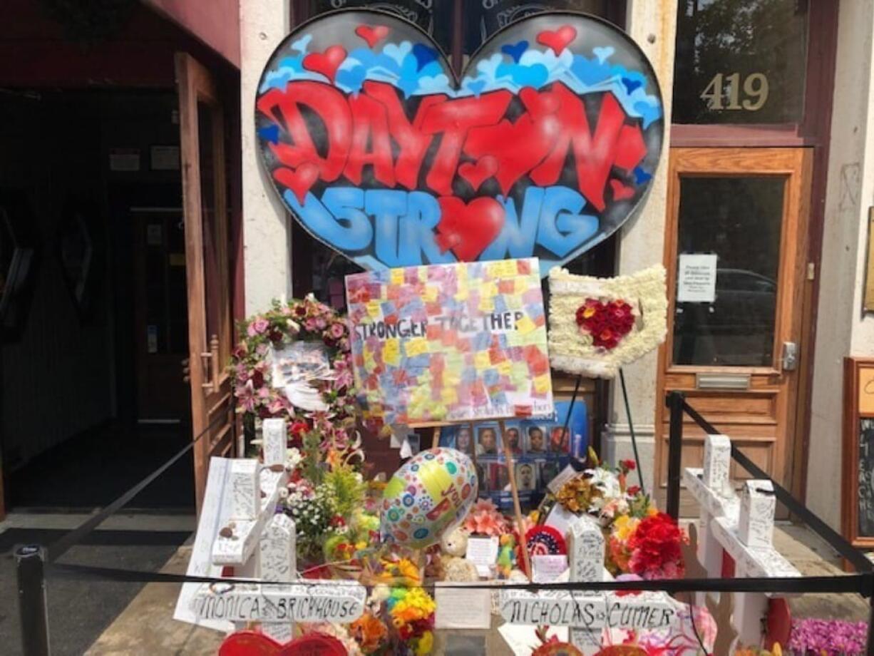 A makeshift memorial sits outside Ned Peppers nightclub in the Oregon District entertainment neighborhood where on Aug. 4 a gunman killed nine people, on Wednesday, Aug.