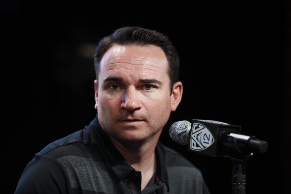 In this July 25, 2018 photo Oregon State head coach Jonathan Smith speaks at the Pac-12 Conference NCAA college football Media Day in Los Angeles. Oregon State’s players headed into fall camp are wearing orange wristbands stamped with the word “urgency.” That’s the theme for the Beavers as they embark on their second year under coach Jonathan Smith. The team is looking for an urgent turnaround after going 2-10 in Smith’s debut season. (AP Photo/Jae C.