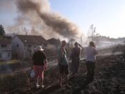 A grass fire seen Monday, Aug.