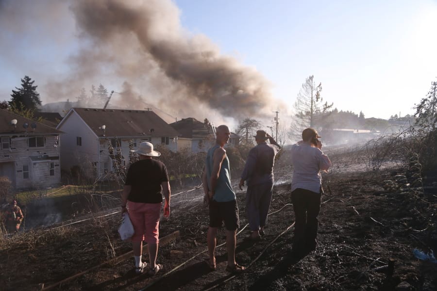 A grass fire seen Monday, Aug.