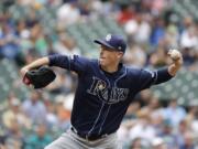 Tampa Bay Rays starting pitcher Ryan Yarbrough throws against the Seattle Mariners during the first inning of a baseball game, Sunday, Aug. 11, 2019, in Seattle. (AP Photo/Ted S.