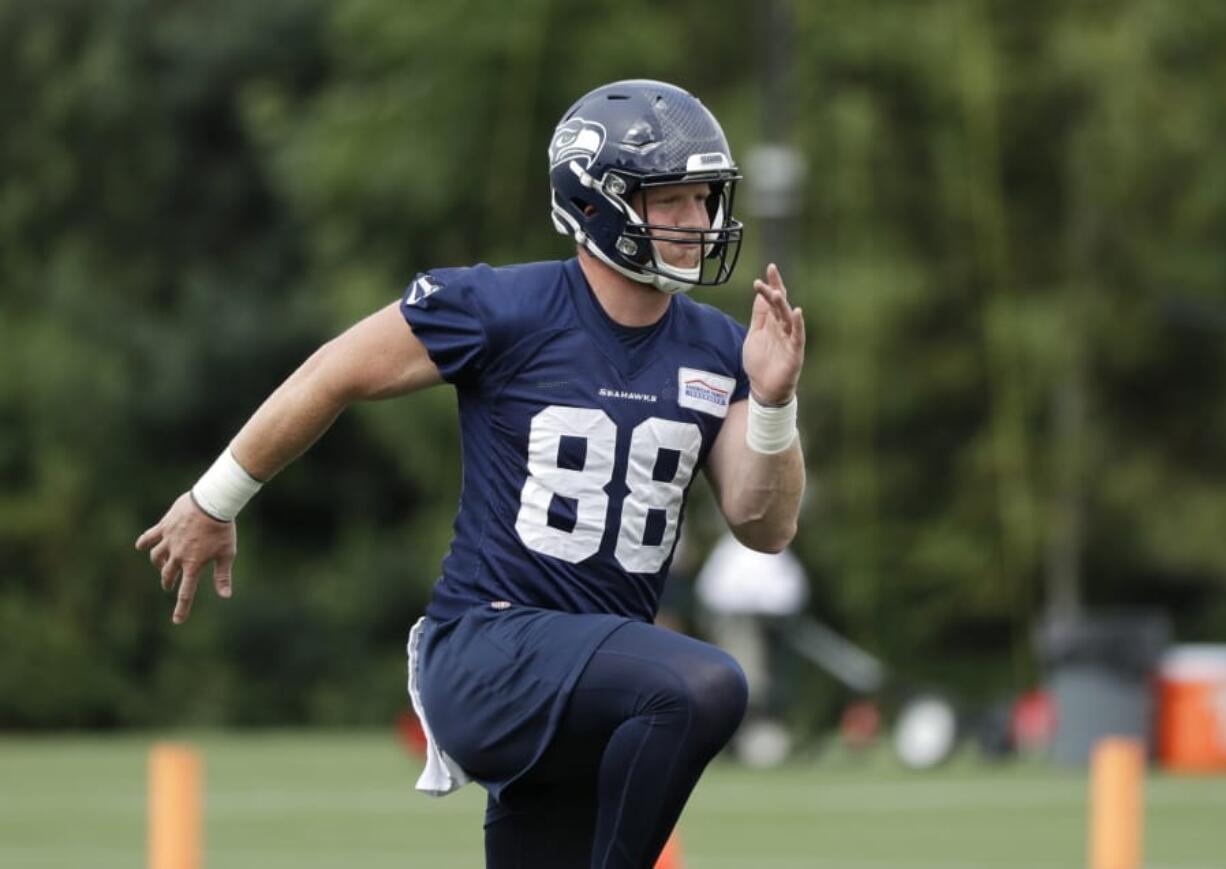 Seattle Seahawks tight end Will Dissly runs at an NFL football training camp Thursday, Aug. 1, 2019, in Renton, Wash.