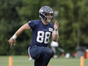 Seattle Seahawks tight end Will Dissly runs at an NFL football training camp Thursday, Aug. 1, 2019, in Renton, Wash.