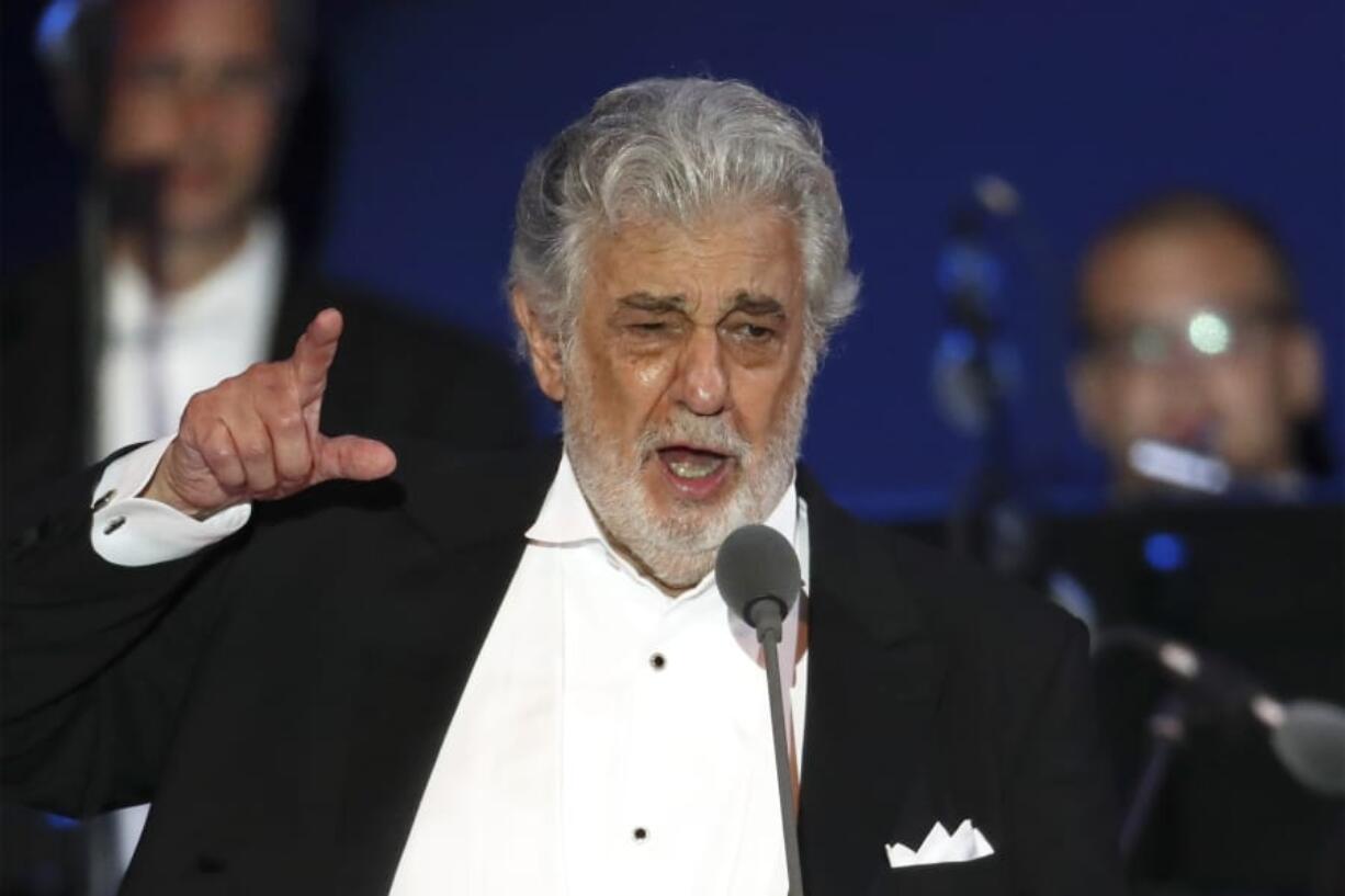 FILE- In this Aug. 28, 2019, file photo, opera star Placido Domingo performs during a concert in Szeged, Hungary. The Tokyo Olympics organizing committee has not decided what it plans to do about the appearance of Placido Domingo at a 2020 Games event and is looking into reports of sexual harassment by the opera star.