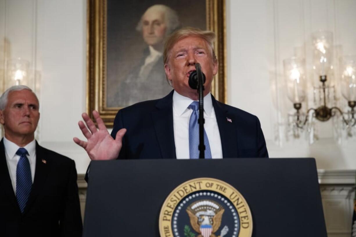 Vice President Mike Pence listens as President Donald Trump speaks about the mass shootings in El Paso, Texas and Dayton, Ohio, in the Diplomatic Reception Room of the White House, Monday, Aug. 5, 2019, in Washington.